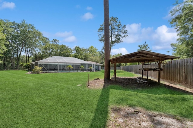 2626 NW 36th Pl, Gainesville, FL 32605 - fenced backyard featuring a lanai