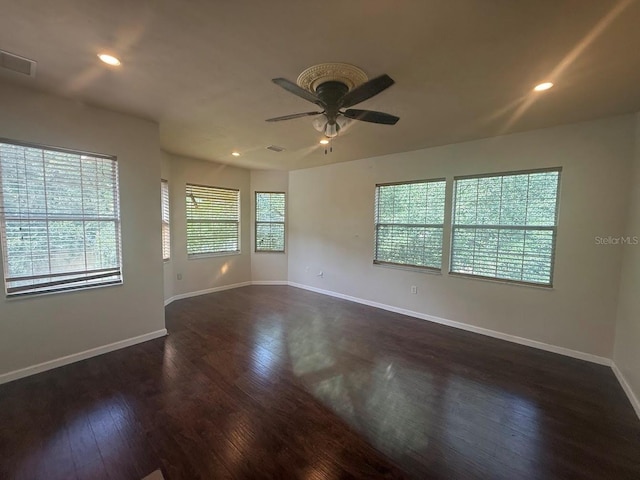 9405 SW 31st Ln, Gainesville, FL 32608 - spare room featuring a ceiling fan, dark wood-style flooring, and recessed lighting