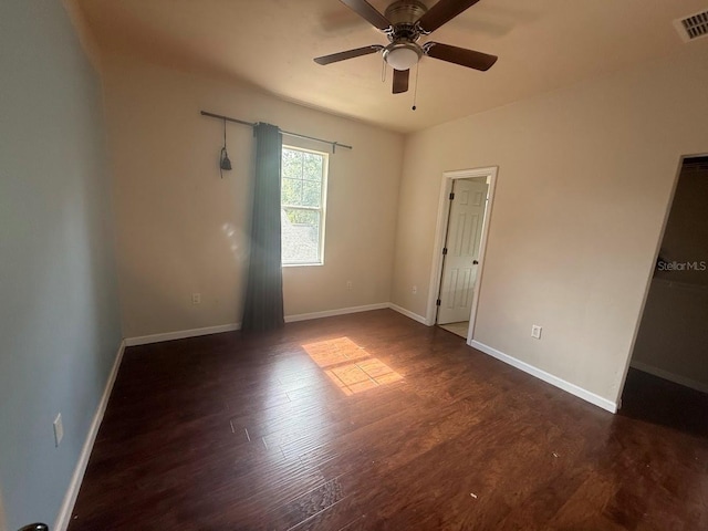 9405 SW 31st Ln, Gainesville, FL 32608 - unfurnished bedroom featuring dark wood-type flooring and ceiling fan