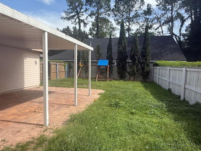 9405 SW 31st Ln, Gainesville, FL 32608 - fenced backyard with a patio area