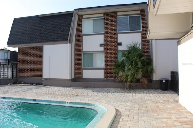 1700 SW 16th Ct Unit E30, Gainesville, FL 32608 - community pool featuring a patio area