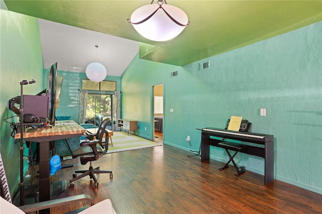 3958 NW 27th Ln, Gainesville, FL 32606 - office space featuring wood finished floors, vaulted ceiling, and a textured wall