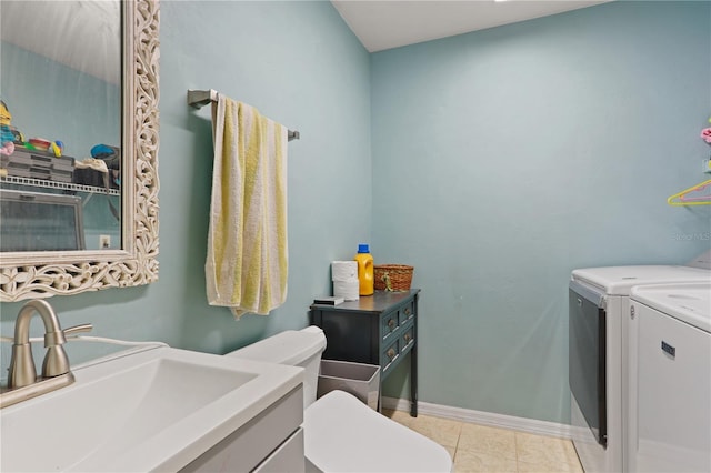 3958 NW 27th Ln, Gainesville, FL 32606 - laundry room featuring washing machine and clothes dryer and light tile patterned floors