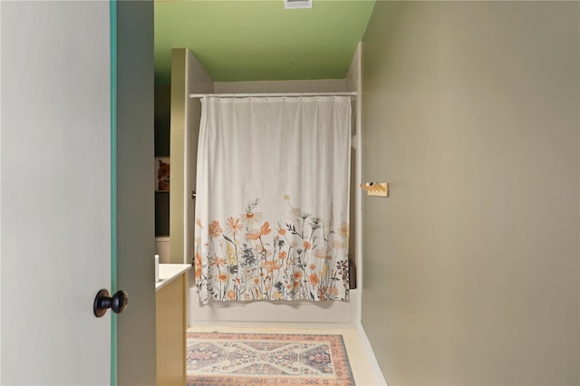 3958 NW 27th Ln, Gainesville, FL 32606 - bathroom with vanity and a shower with shower curtain