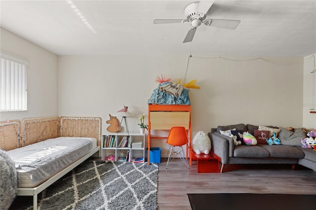 3958 NW 27th Ln, Gainesville, FL 32606 - bedroom with wood finished floors and a ceiling fan