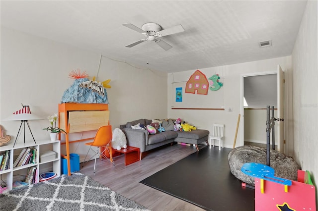 3958 NW 27th Ln, Gainesville, FL 32606 - recreation room featuring a ceiling fan and wood finished floors