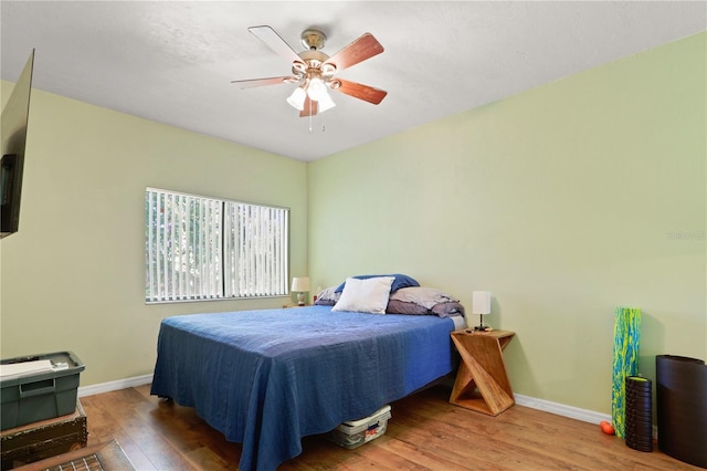 3958 NW 27th Ln, Gainesville, FL 32606 - bedroom featuring wood finished floors and a ceiling fan