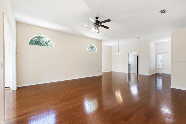 6033 NW 36th Dr, Gainesville, FL 32653 - unfurnished living room featuring a ceiling fan and dark wood-style floors