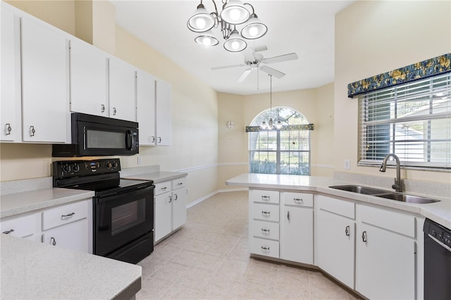 6033 NW 36th Dr, Gainesville, FL 32653 - kitchen featuring black appliances, a chandelier, light countertops, and white cabinetry