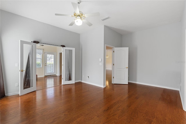 6033 NW 36th Dr, Gainesville, FL 32653 - unfurnished bedroom featuring wood finished floors and a ceiling fan