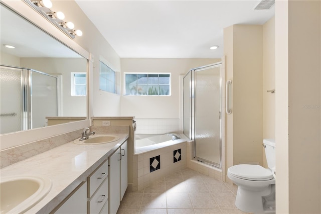 6033 NW 36th Dr, Gainesville, FL 32653 - full bathroom featuring double vanity, a bath, a shower stall, and tile patterned floors