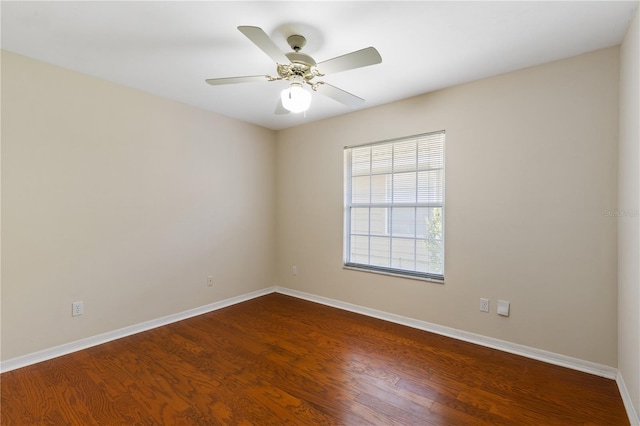 6033 NW 36th Dr, Gainesville, FL 32653 - empty room featuring dark wood-style floors and a ceiling fan