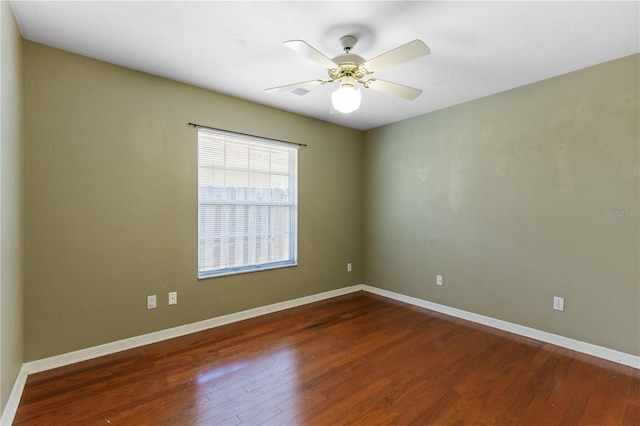 6033 NW 36th Dr, Gainesville, FL 32653 - spare room with wood finished floors and ceiling fan
