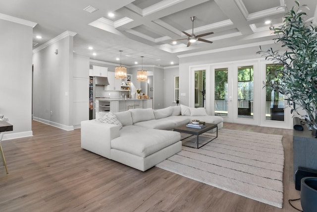 9474 SW 65th Pl, Gainesville, FL 32608 - living room featuring a ceiling fan, ornamental molding, wood finished floors, recessed lighting, and beamed ceiling