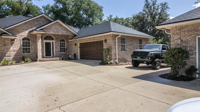 2361 Sandy Run Dr N, Middleburg, FL 32068 - view of front of property featuring brick siding, a garage, concrete driveway, and roof with shingles