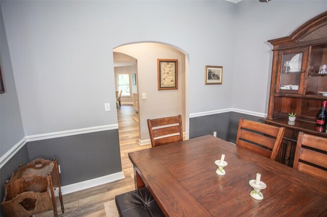 2361 Sandy Run Dr N, Middleburg, FL 32068 - dining room with arched walkways and wood finished floors