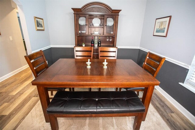 2361 Sandy Run Dr N, Middleburg, FL 32068 - dining area featuring light wood-type flooring and arched walkways