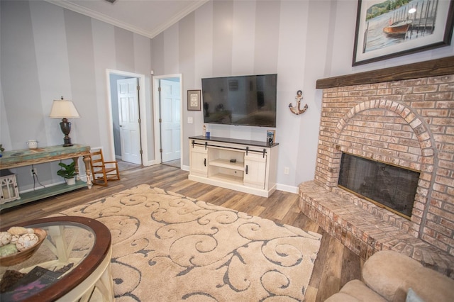 2361 Sandy Run Dr N, Middleburg, FL 32068 - living area featuring wood finished floors, ornamental molding, and a brick fireplace