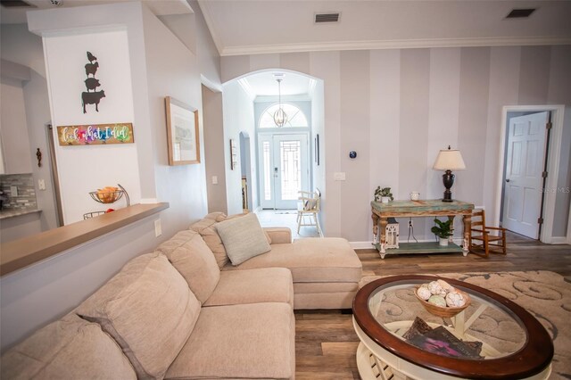 2361 Sandy Run Dr N, Middleburg, FL 32068 - living area featuring wood finished floors, arched walkways, and ornamental molding