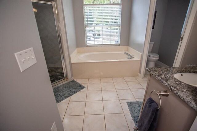 2361 Sandy Run Dr N, Middleburg, FL 32068 - bathroom with a garden tub, tile patterned flooring, a stall shower, and vanity