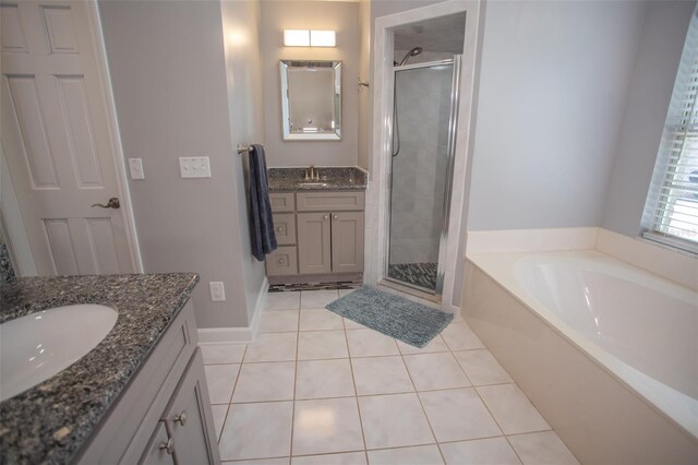 2361 Sandy Run Dr N, Middleburg, FL 32068 - full bath featuring a shower stall, two vanities, a garden tub, and tile patterned flooring