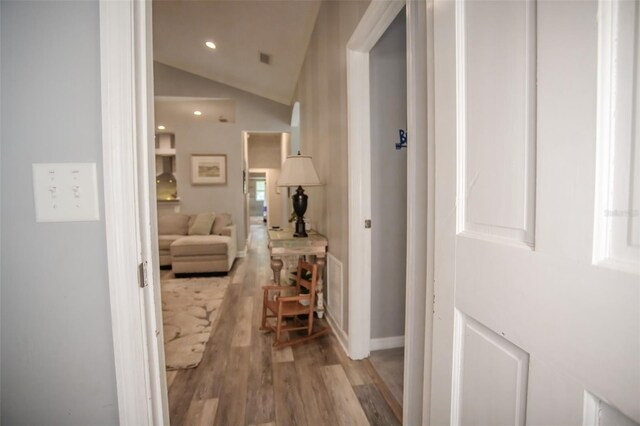 2361 Sandy Run Dr N, Middleburg, FL 32068 - corridor with light wood-style floors, vaulted ceiling, and recessed lighting