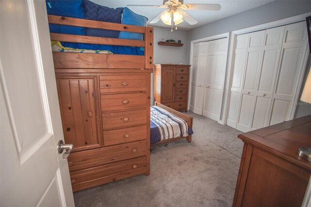 2361 Sandy Run Dr N, Middleburg, FL 32068 - bedroom with light carpet, two closets, and a ceiling fan