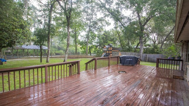 2361 Sandy Run Dr N, Middleburg, FL 32068 - wooden terrace featuring a playground and a fenced backyard