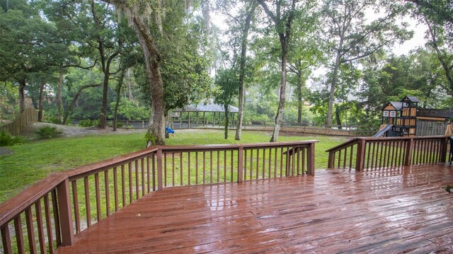 2361 Sandy Run Dr N, Middleburg, FL 32068 - wooden terrace featuring a playground and a fenced backyard