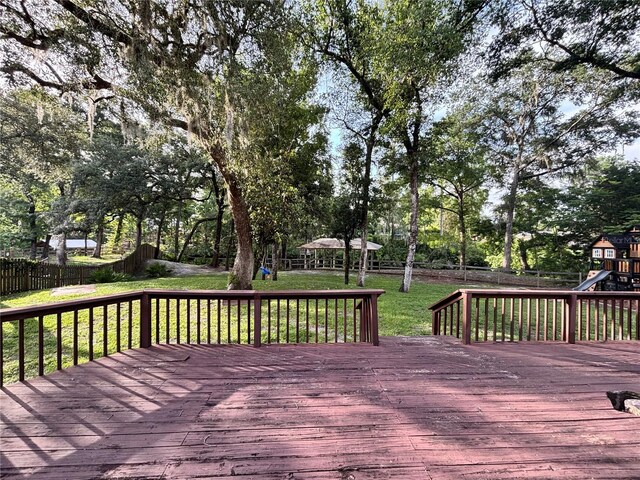 2361 Sandy Run Dr N, Middleburg, FL 32068 - deck featuring a playground, a fenced backyard, a gazebo, and view of wooded area