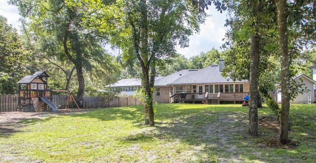 2361 Sandy Run Dr N, Middleburg, FL 32068 - view of yard with a playground and a wooden deck
