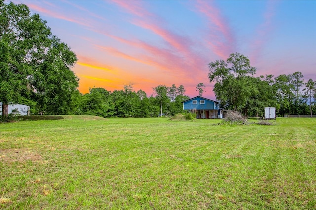 14727 SW 92nd St, Lake Butler, FL 32054 - yard at dusk featuring a lawn