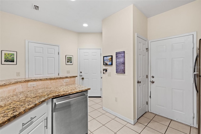 13200 W Newberry Rd Unit T110, Newberry, FL 32669 - kitchen with dishwasher, light tile patterned flooring, white cabinetry, light stone counters, and recessed lighting