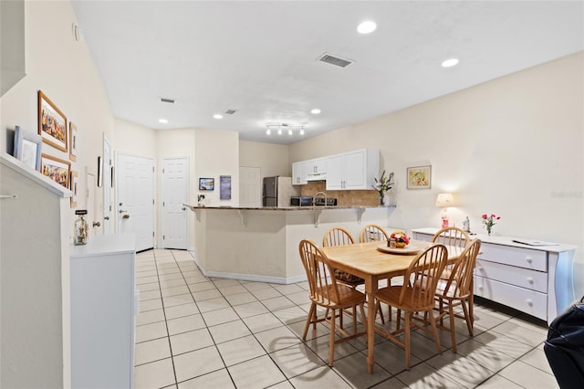 13200 W Newberry Rd Unit T110, Newberry, FL 32669 - dining room with light tile patterned floors and recessed lighting