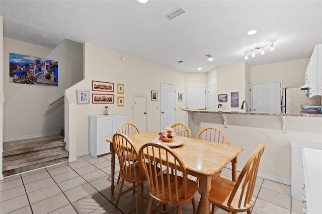 13200 W Newberry Rd Unit T110, Newberry, FL 32669 - dining space featuring light tile patterned floors, recessed lighting, and stairs