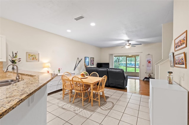 13200 W Newberry Rd Unit T110, Newberry, FL 32669 - dining room with light tile patterned floors, a ceiling fan, and recessed lighting
