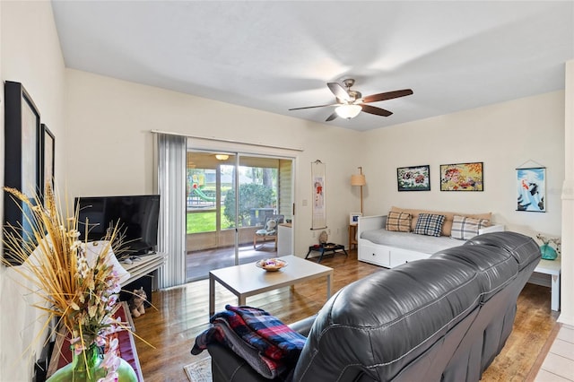 13200 W Newberry Rd Unit T110, Newberry, FL 32669 - living area with a ceiling fan and wood finished floors