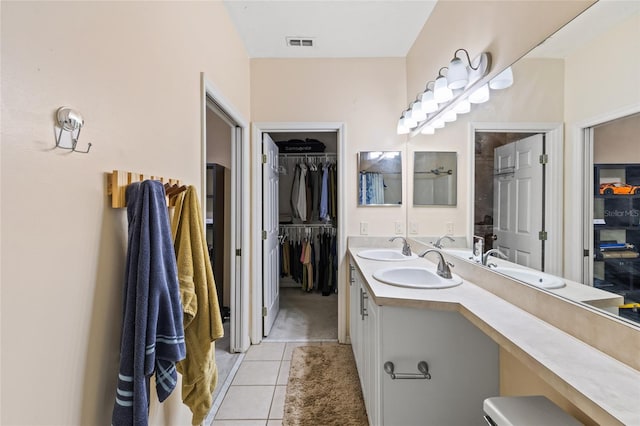 13200 W Newberry Rd Unit T110, Newberry, FL 32669 - bathroom with tile patterned floors, double vanity, and a walk in closet