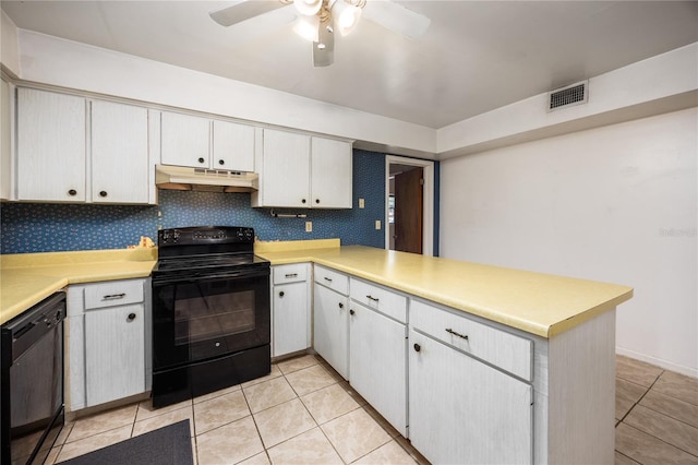 2147 NW 7th Pl, Gainesville, FL 32603 - kitchen with black appliances, under cabinet range hood, a peninsula, and light countertops