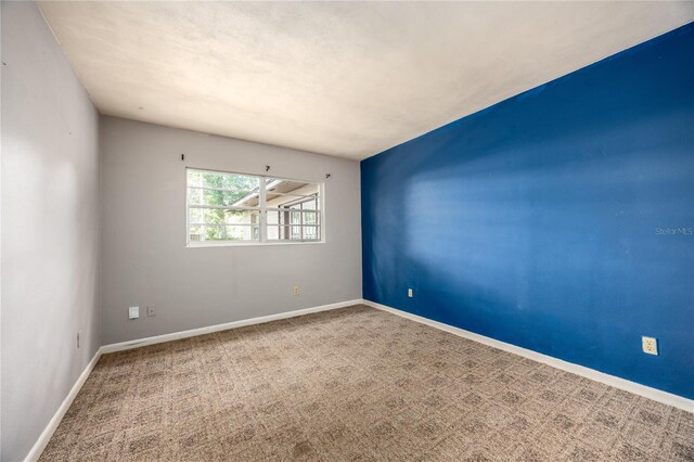 2147 NW 7th Pl, Gainesville, FL 32603 - carpeted empty room with baseboards