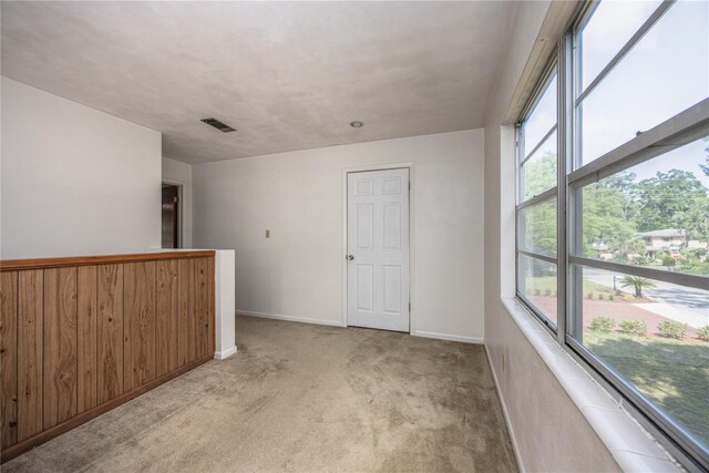 2147 NW 7th Pl, Gainesville, FL 32603 - spare room with carpet flooring and healthy amount of natural light
