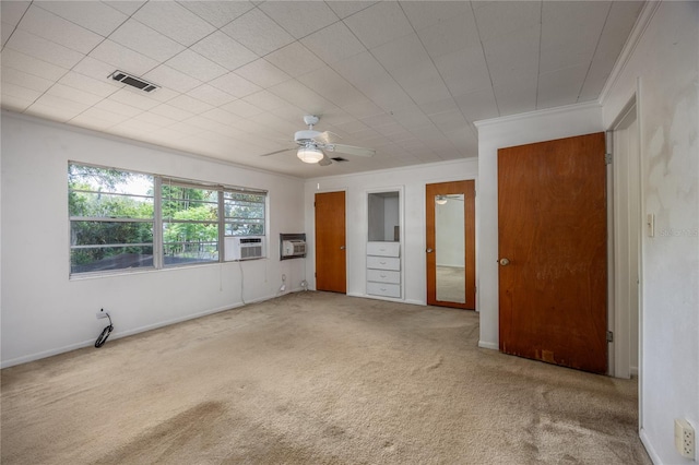 2147 NW 7th Pl, Gainesville, FL 32603 - unfurnished bedroom featuring carpet floors, ornamental molding, and ceiling fan