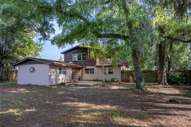 2147 NW 7th Pl, Gainesville, FL 32603 - back of property featuring a patio and a wall unit AC