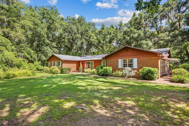 2809 SW 81st St, Gainesville, FL 32608 - ranch-style home featuring brick siding and a front yard