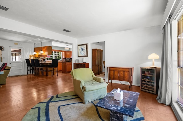 2809 SW 81st St, Gainesville, FL 32608 - living room featuring beverage cooler and wood finished floors