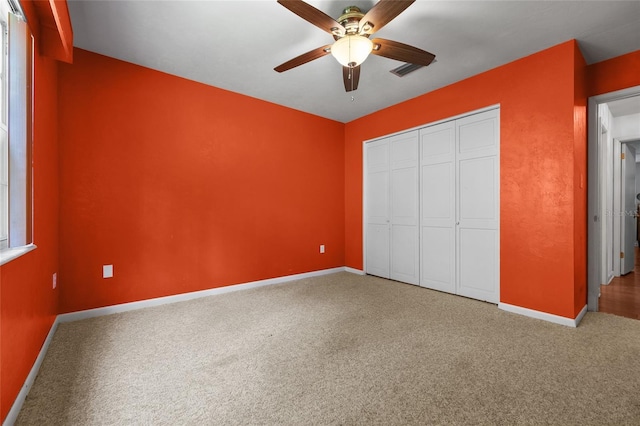 2809 SW 81st St, Gainesville, FL 32608 - unfurnished bedroom with carpet flooring, a closet, and a ceiling fan