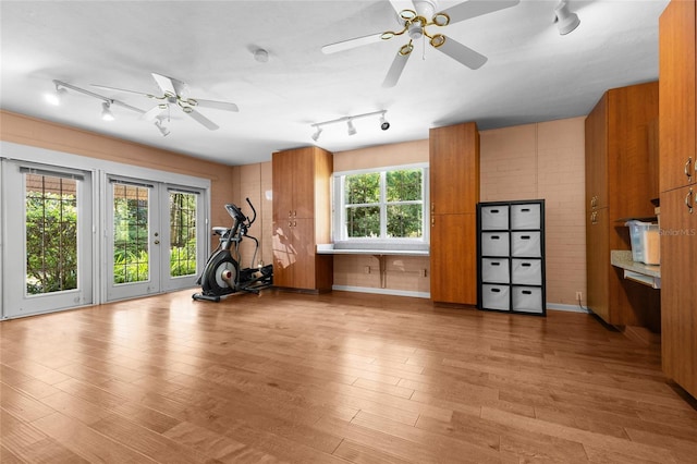 2809 SW 81st St, Gainesville, FL 32608 - exercise area with track lighting, a ceiling fan, wood finished floors, and french doors