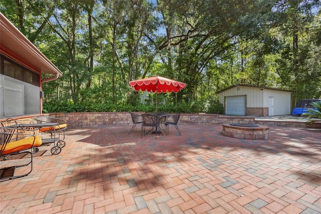 2809 SW 81st St, Gainesville, FL 32608 - view of patio with a fire pit, outdoor dining area, and an outdoor structure