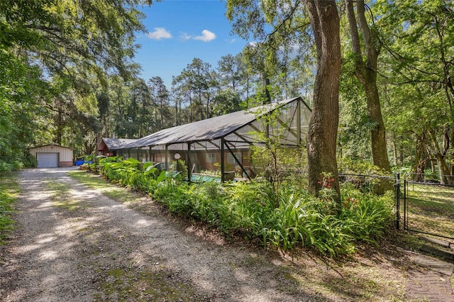 2809 SW 81st St, Gainesville, FL 32608 - exterior space with dirt driveway, a garage, and an outbuilding