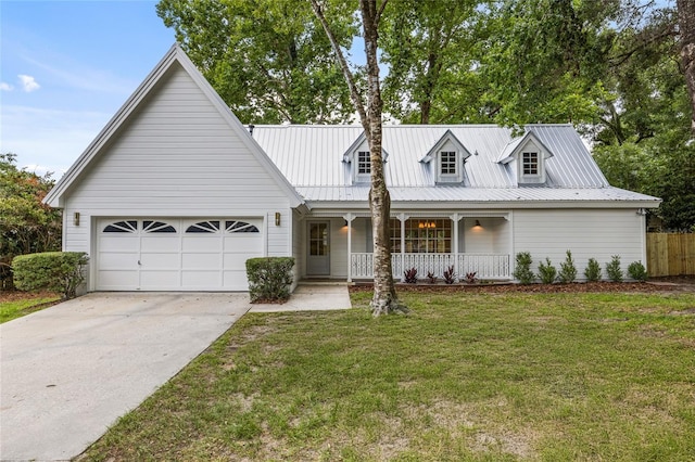 10943 NW 34th Pl, Gainesville, FL 32606 - view of front of home with covered porch, driveway, a garage, and a metal roof